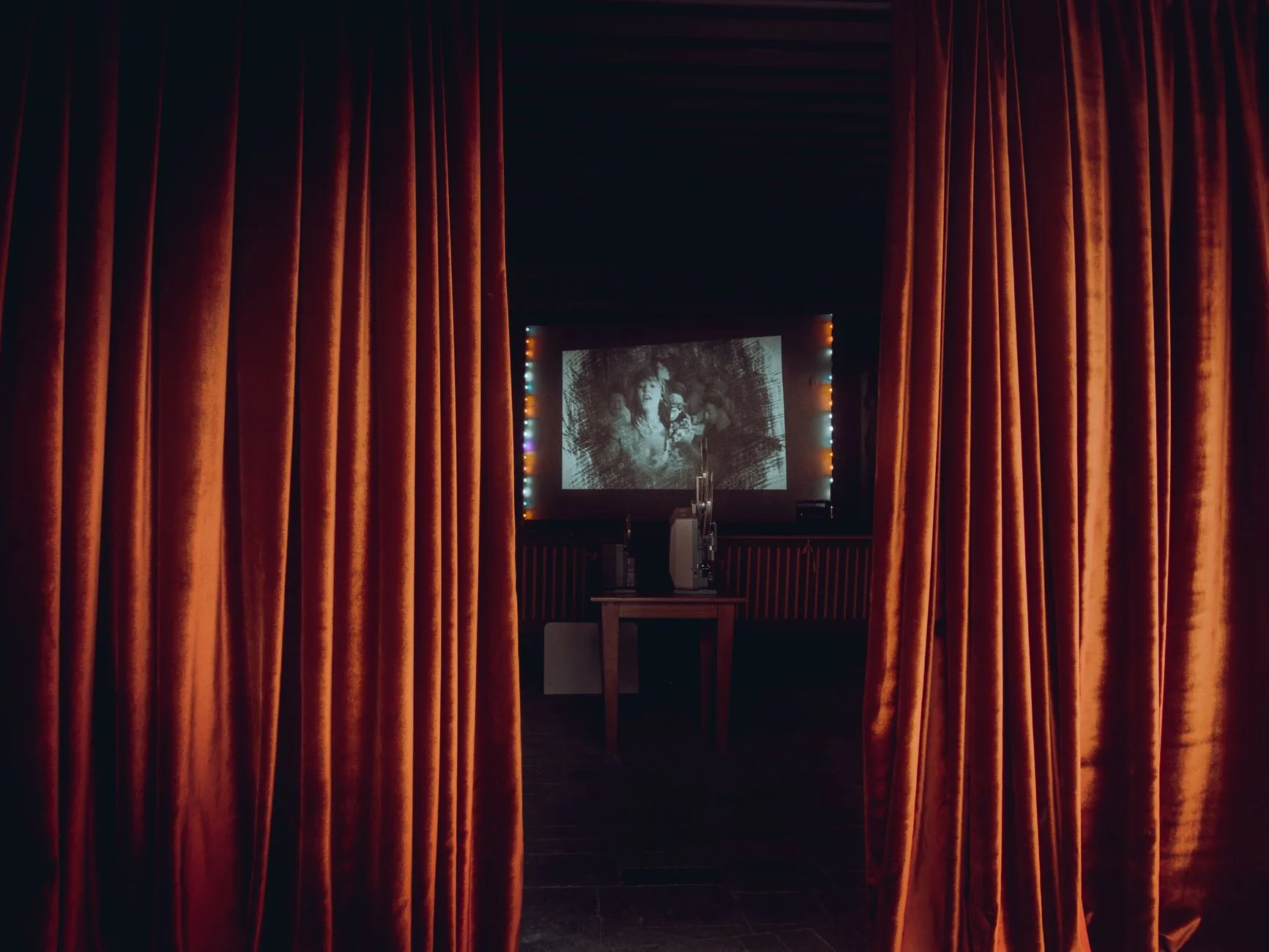Abandoned animation studio with vintage equipment, sunlight streaming through amber windows, Vaudeville to modern hits.